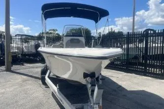 Slide: The Image of 2022 Key West 203 DFS boat on trailer with canopy in sunny marina. - 5