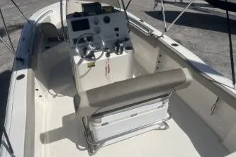 Slide: The Image of 2022 Key West 203 DFS boat interior with steering console and seating. - 7
