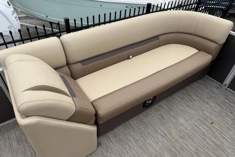 Slide: The Image of 2023 Godfrey Sweetwater 2286 C boat seating, beige and brown upholstery, outdoor setting. - 6