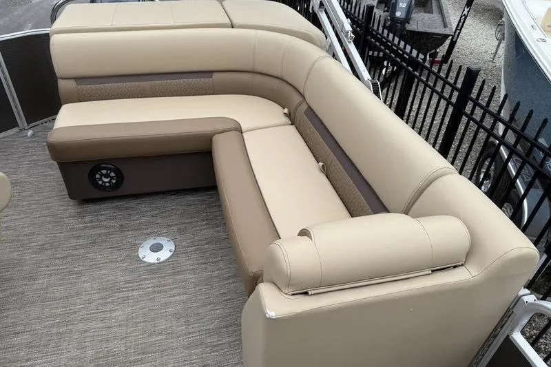 Slide: The Image of 2023 Godfrey Sweetwater 2286 C boat seating with beige upholstery and speaker. - 8