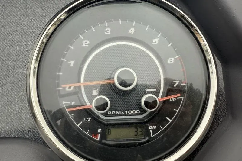 Slide: The Image of Tachometer of 2023 Godfrey Sweetwater 2286 C showing RPM and fuel gauge. - 9