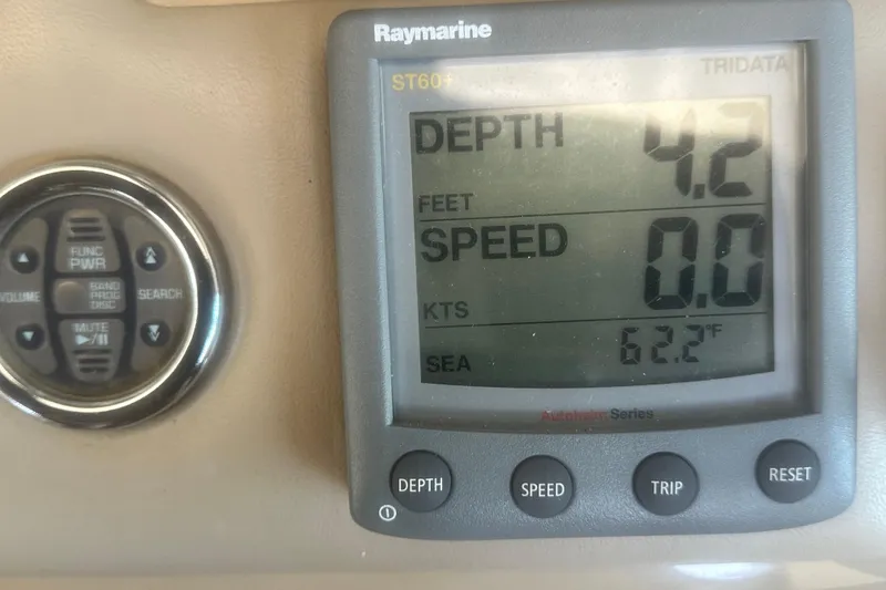 Slide: The Image of Raymarine display on 2000 Sea Ray 310 Sundancer showing depth, speed, and sea temperature. - 22