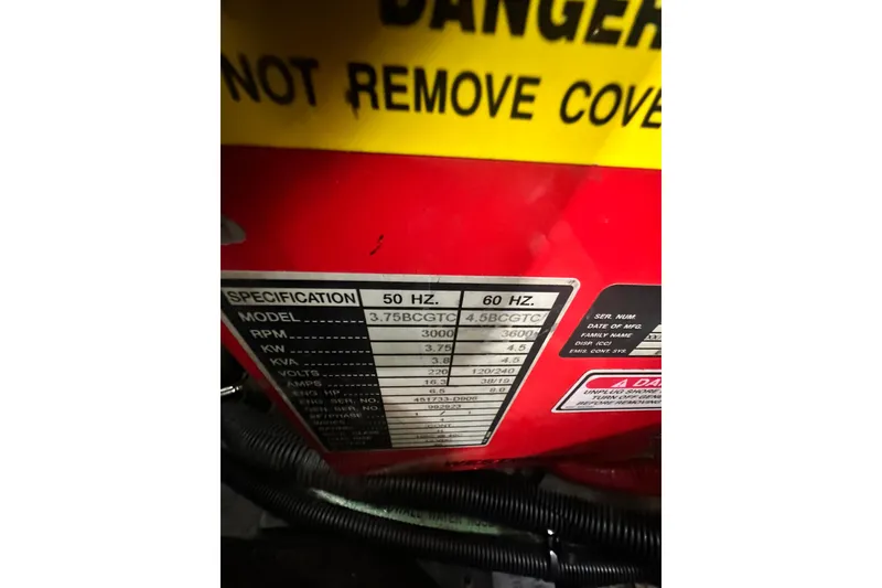 Slide: The Image of Warning label and specifications on a Sea Ray 310 Sundancer, 2000 model. - 49