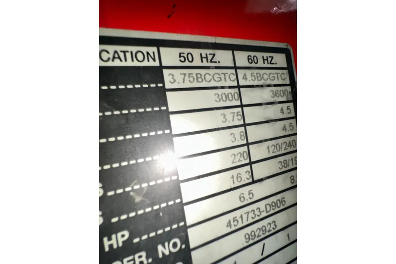 Slide: The Image of Close-up of a Sea Ray 310 Sundancer 2000 engine specification label. - 52