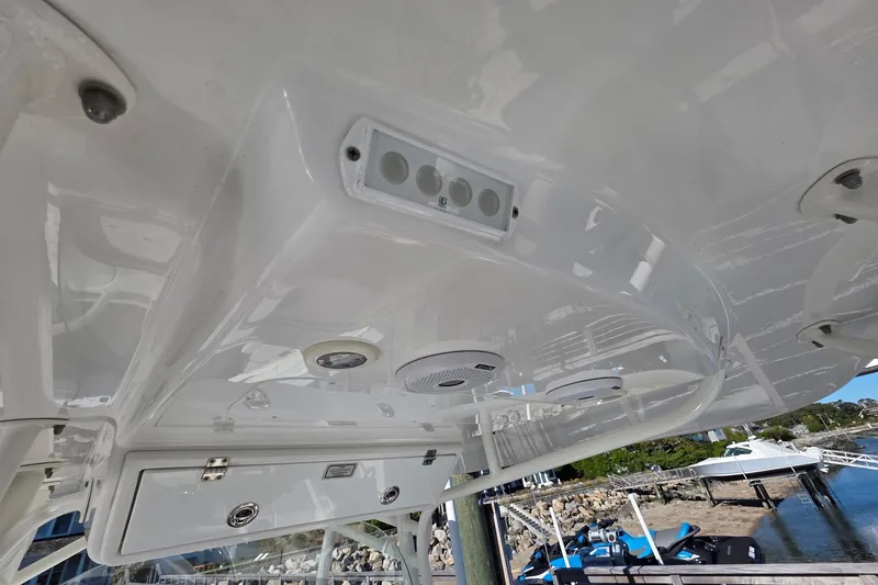 Slide: The Image of 2014 Regulator 34 boat interior, featuring speakers and control panel. - 14