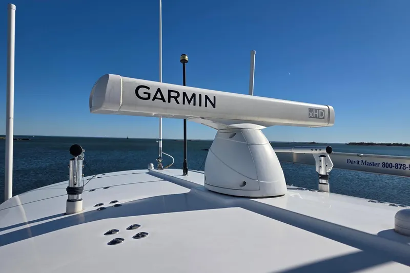 Slide: The Image of 2014 Regulator 34 boat with Garmin xHD radar on the deck, ocean background. - 16