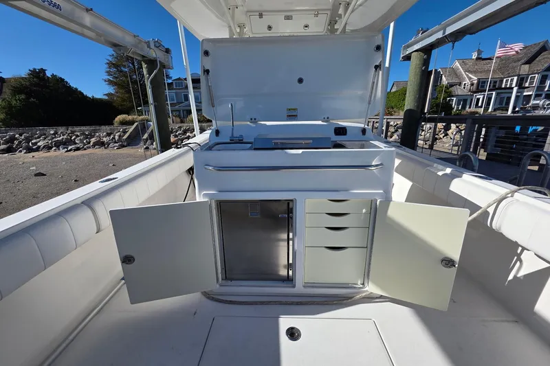 Slide: The Image of 2014 Regulator 34 boat interior with open storage compartments and drawers. - 8