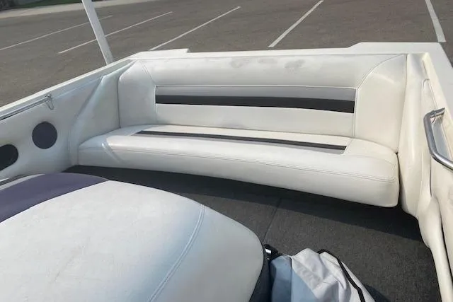 Slide: The Image of 1997 Malibu Echelon boat interior with white seating and black accents. - 10