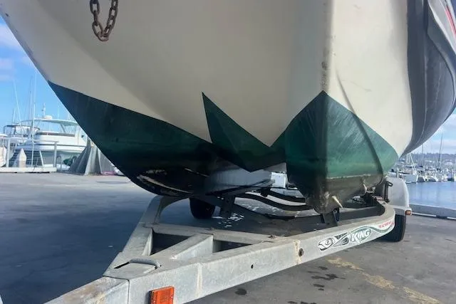 Slide: The Image of Hysucat 650 boat from 2001 on a trailer at a marina, showcasing hull design. - 6