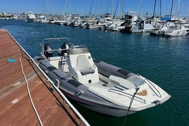 Slide: The Image of Hysucat 650 boat from 2001 docked in a marina with other vessels. - 10