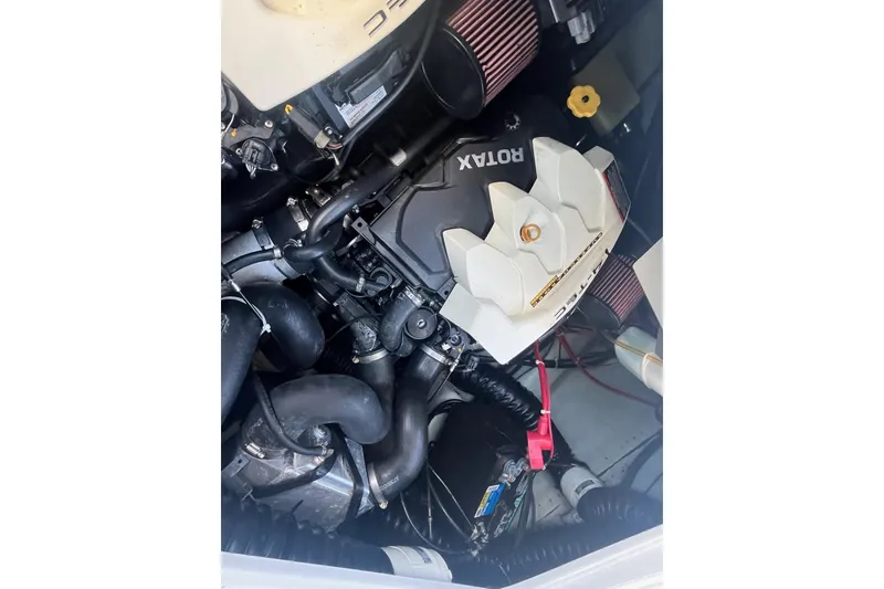 Slide: The Image of 2010 Sea-Doo 230 Challenger SP engine compartment with Rotax engine components. - 10