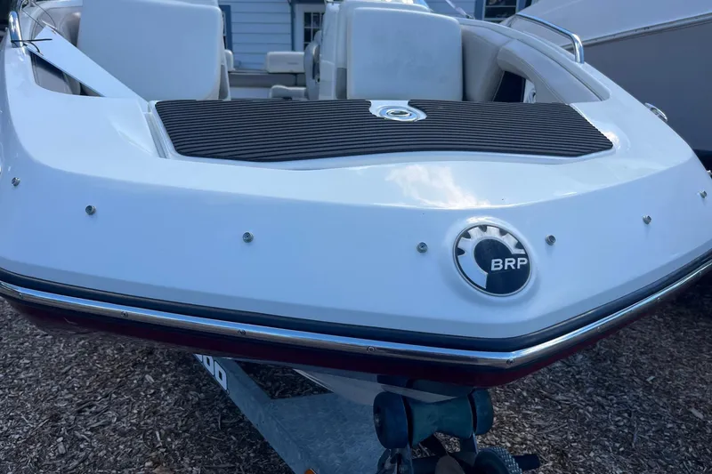 Slide: The Image of 2010 Sea-Doo 230 Challenger SP boat rear view with BRP logo. - 12