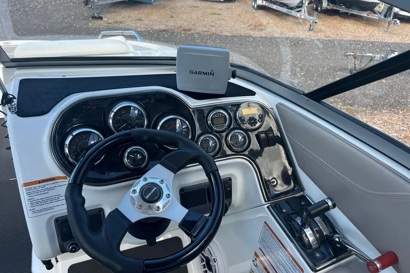 Slide: The Image of 2010 Sea-Doo 230 Challenger SP dashboard with Garmin GPS and control panel. - 3