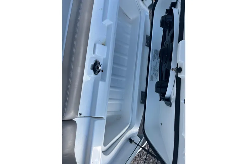 Slide: The Image of 2010 Sea-Doo 230 Challenger SP storage compartment with open hatch and visible interior. - 7