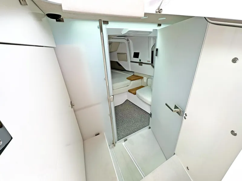 Slide: The Image of 2024 Axopar 37 Sun Top interior cabin with modern design and comfortable seating. - 6