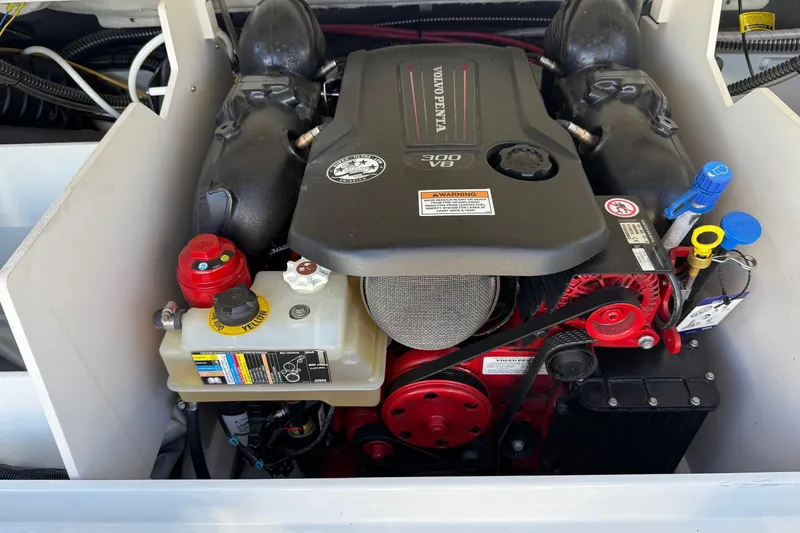 Slide: The Image of 2023 Crownline 240 SS SURF engine compartment with Volvo Penta V8 300 horsepower engine. - 10