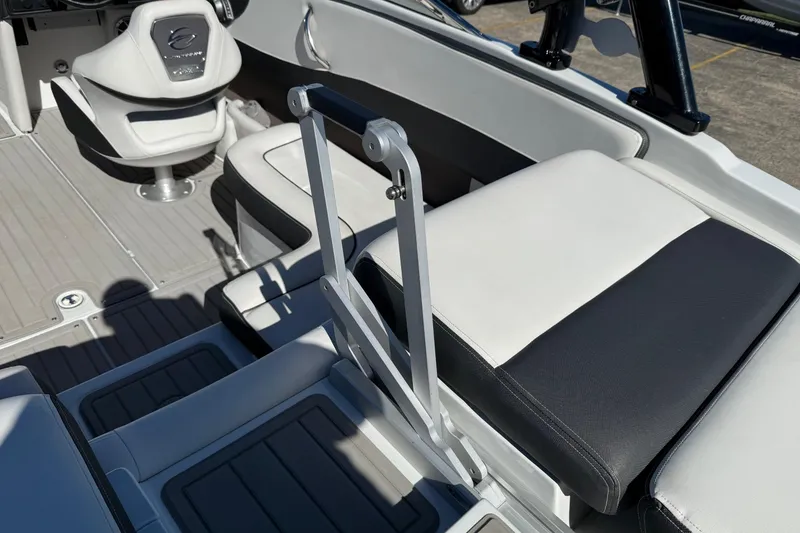 Slide: The Image of 2023 Crownline 240 SS SURF boat interior with sleek seating and modern design. - 11