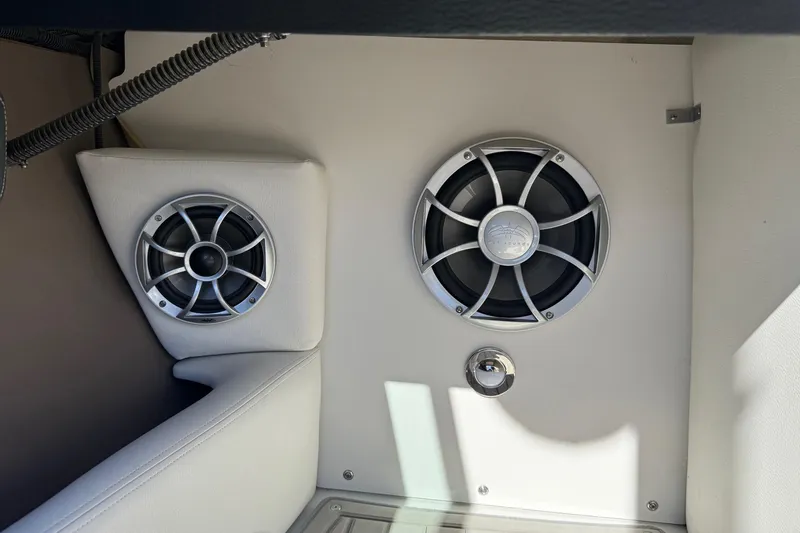 Slide: The Image of 2023 Crownline 240 SS SURF boat interior speakers and upholstery detail. - 18