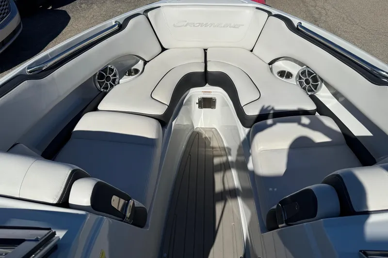 Slide: The Image of 2023 Crownline 240 SS SURF boat interior with plush seating and built-in speakers. - 5