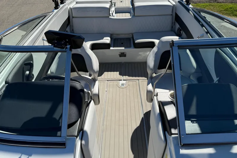 Slide: The Image of 2023 Crownline 240 SS SURF boat interior with seating and open deck layout. - 7