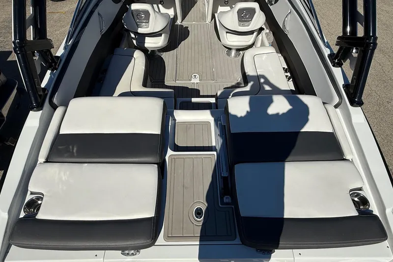 Slide: The Image of 2023 Crownline 240 SS SURF boat interior with sleek seating and modern design. - 9