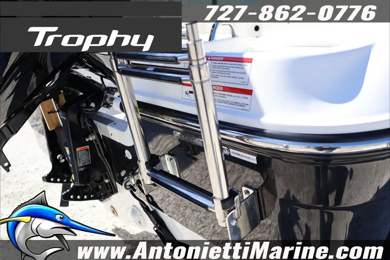 Slide: The Image of Trophy T18 Bay 2026 boat rear view with ladder, contact info, and website details. - 10