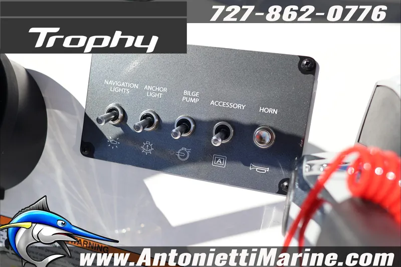 Slide: The Image of Control panel of 2026 Trophy T18 Bay boat with switches for lights and accessories. - 14