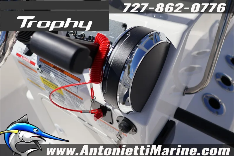 Slide: The Image of 2026 Trophy T18 Bay boat control panel with throttle and safety features. - 15