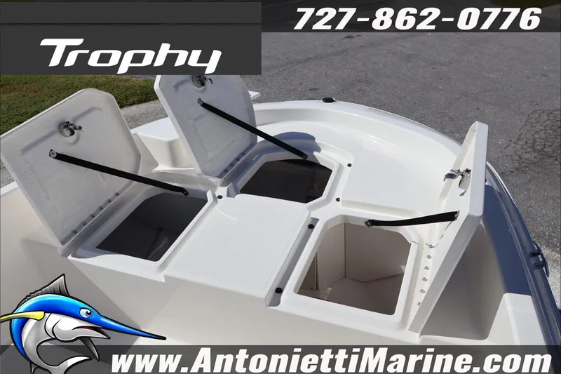 Slide: The Image of 2026 Trophy T18 Bay boat storage compartments open, showcasing spacious design. - 18