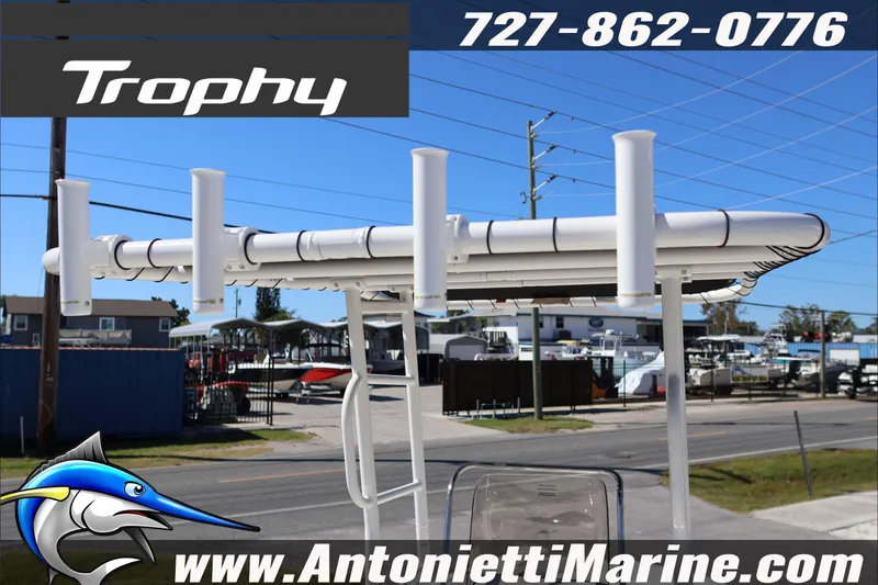 Slide: The Image of Trophy T18 Bay boat display at Antonietti Marine, showcasing rod holders and contact information. - 28