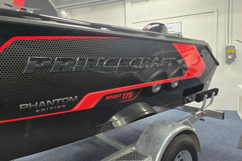 Slide: The Image of 2026 Princecraft Sport 175 Phantom Edition boat on trailer, showcasing sleek design and branding. - 14