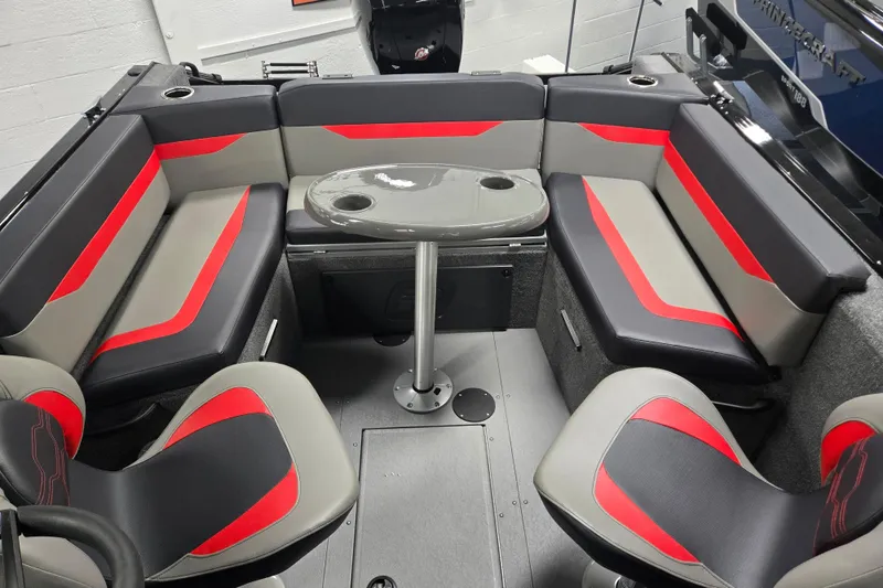 Slide: The Image of 2026 Princecraft Sport 175 boat interior with red and gray seating and a central table. - 17