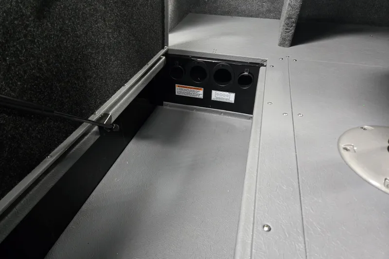 Slide: The Image of 2026 Princecraft Sport 175 boat interior storage compartment with gray flooring. - 3