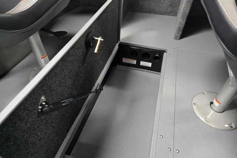 Slide: The Image of 2026 Princecraft Sport 175 boat interior with open storage compartment and seating. - 4