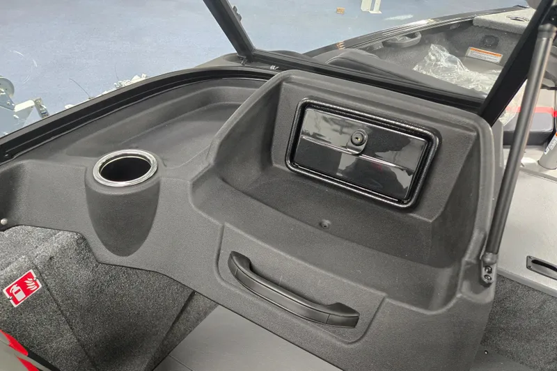 Slide: The Image of Interior of 2026 Princecraft Sport 175 boat, featuring a cup holder and storage compartment. - 6