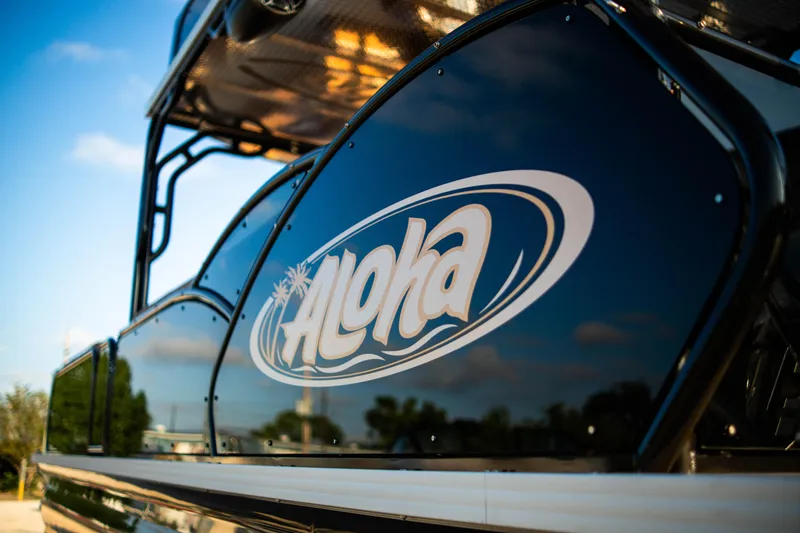 Slide: The Image of 2026 Aloha Paradise 300 Sundeck boat with logo, sunny day background. - 5