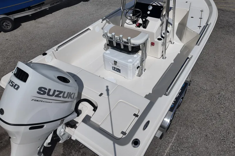 Slide: The Image of 2026 Bulls Bay 2200 boat with Suzuki 150 engine, featuring spacious deck and modern controls. - 10