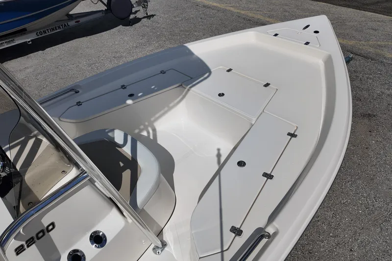 Slide: The Image of 2026 Bulls Bay 2200 boat interior with storage compartments and seating. - 14
