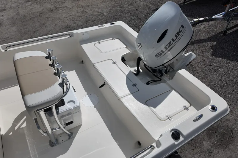 Slide: The Image of 2026 Bulls Bay 2200 boat with Suzuki outboard motor, featuring seating and rod holders. - 19