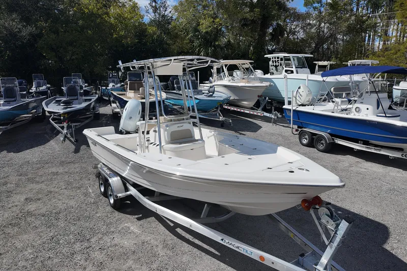 Slide: The Image of 2026 Bulls Bay 2200 boat on trailer, surrounded by other boats in a lot. - 3