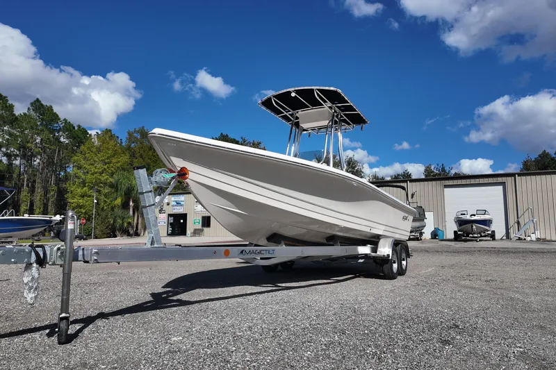 Slide: The Image of 2026 Bulls Bay 2200 boat on trailer under clear blue sky. - 4