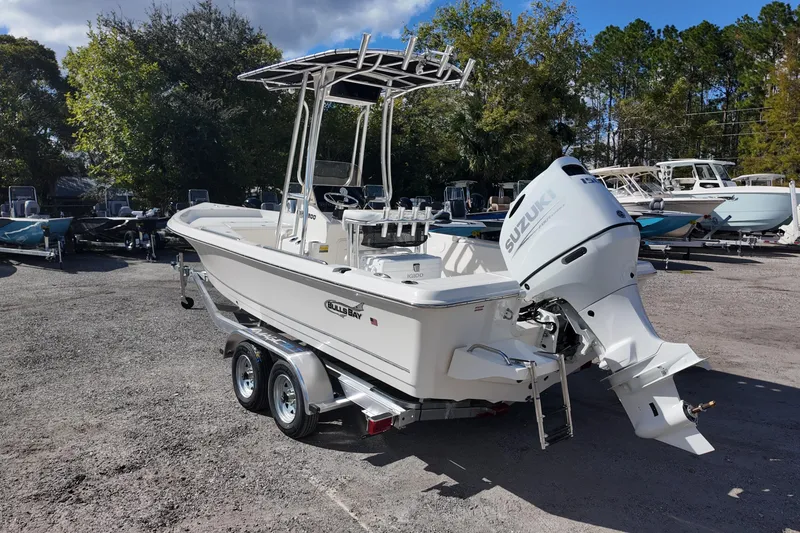 Slide: The Image of 2026 Bulls Bay 2200 boat with Suzuki engine on a trailer in a sunny outdoor setting. - 5