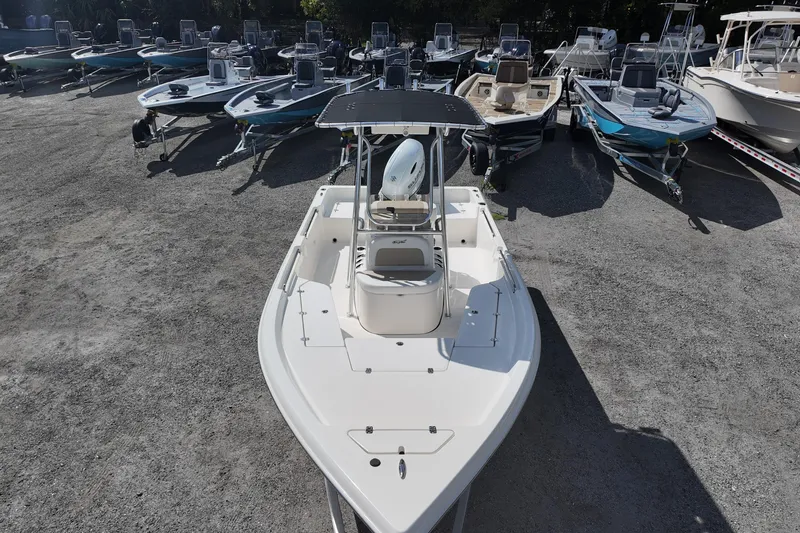 Slide: The Image of 2026 Bulls Bay 2200 boat displayed among other boats in a dealership lot. - 8