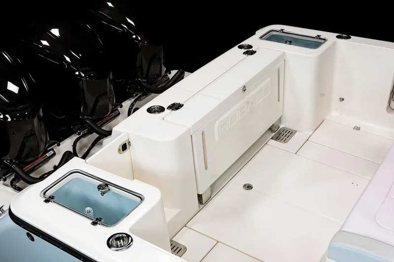 Slide: The Image of 2026 Robalo R360 Center Console boat with triple engines, rear view. - 17
