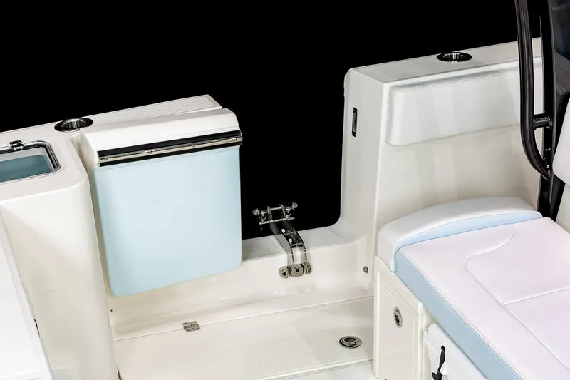 Slide: The Image of 2026 Robalo R360 Center Console boat interior with white seating and cup holders. - 19