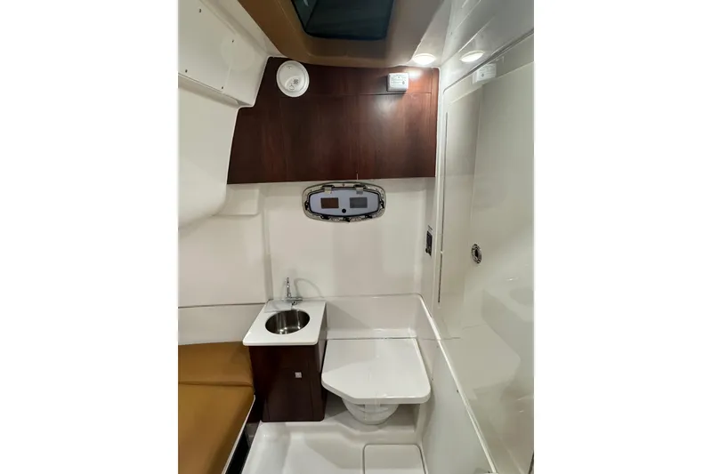 Slide: The Image of 2026 Robalo R360 Center Console interior with sink, toilet, and modern design. - 25