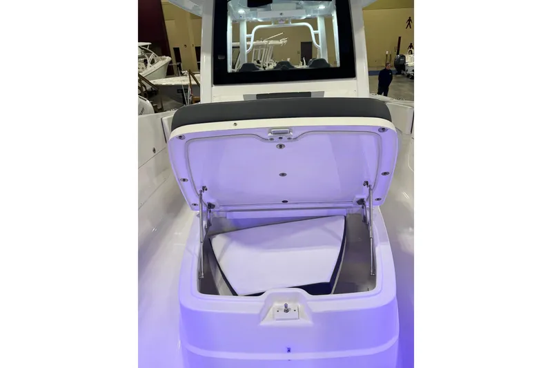 Slide: The Image of 2026 Robalo R360 Center Console boat with open storage compartment. - 29