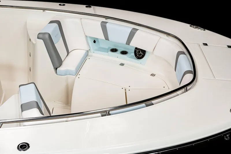 Slide: The Image of 2026 Robalo R360 Center Console boat displayed indoors on stands. - 9