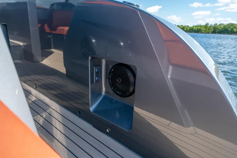 Slide: The Image of 2022 Vanquish Yachts VQ45 speaker detail on deck, with water and sky background. - 13
