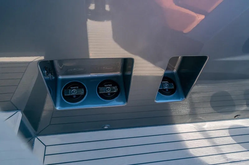 Slide: The Image of 2022 Vanquish Yachts VQ45 yacht deck with waste, water, and diesel access points. - 14